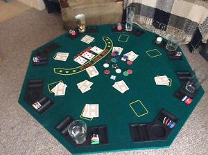 Folding Texas Hold Em poker table with chip and beverage