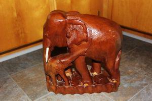 Large hand-carved elephant with calf