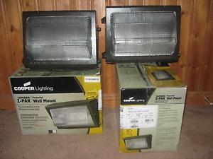 Lot of 2 - Cooper Wall Pack Fixtures 100W, 1 NEW & 1 used a