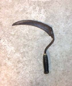 Vintage hand sickle and brush cleaner