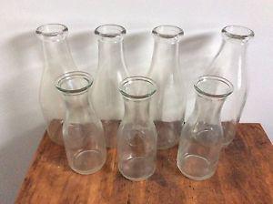 Old milk jugs 12 large and three small ones left
