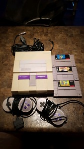 SNES with 2 controllers and 3 games