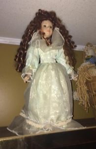 vintage porcelain doll with stand