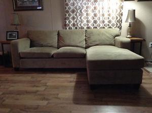 Beige sofa with chaise lounge on the end