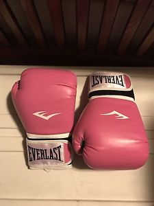 Pink unused boxing gloves