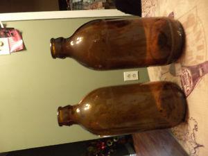 3 brown stubby bottles