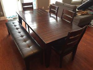 7 1/2 ft Solid wood table with 4 chairs and bench