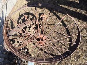 Antique 4' steel wagon wheel us axle.