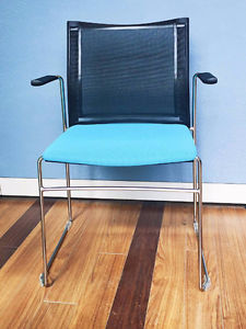 Italian made chair with blue fabric seat black mesh backrest