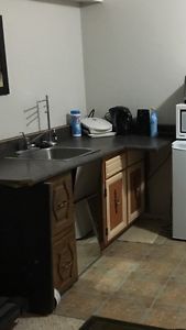 Kitchen counter, sink, cabinet
