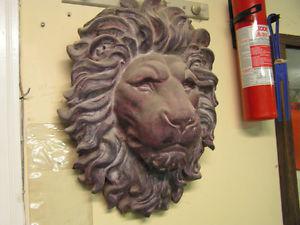 Lion head wall statue