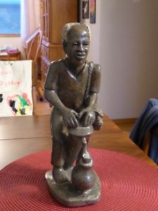 Stone carving-African man playing drum