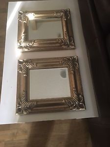 Two framed beveled mirrors