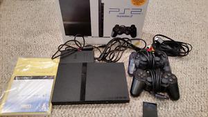 Playstation 2 console w/ Guitar Hero guitars & games