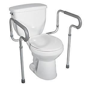 TOILET SAFETY HAND RAIL AND RAISED 4 INCH TOILET SEAT.