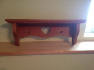 Wooden shelf with hearts.