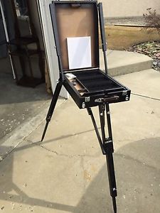 Fold up easel with accessories