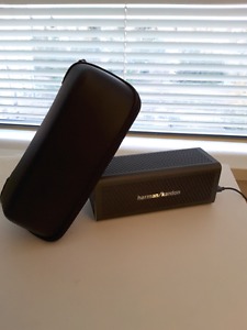 H k one Bluetooth speaker with case.