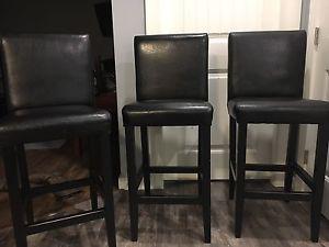 3 faux leather chairs