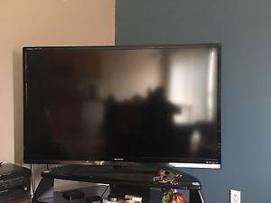60" sharp smart tv with stand.