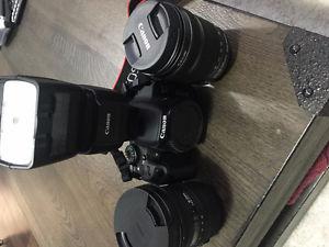 Canon rebel t51 camera with 2 lenses, flash, tripod, carry