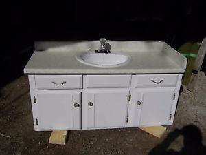 older vanity with sink and facet
