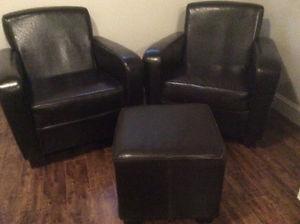 2 leather chairs and ottoman