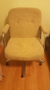 Beige padded rolling office chair
