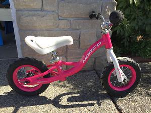Girls Pink and White Norco Strider Bike