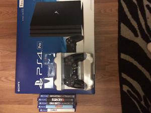 Playstation PS4 Pro (new in box) 5 games extra new