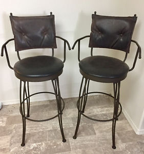 Solid rod iron bar stools with dapple brown suede cushions