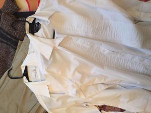 2 white pleated dress shirts.
