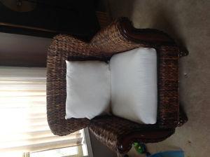 Rattan chair with cushions and wood accent