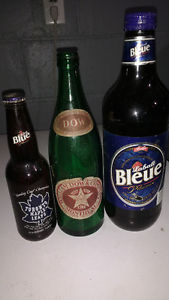 Two old beer bottles one Toronto Maple Leafs