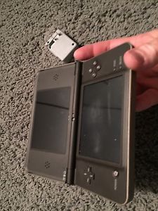 Copper Nintendo DSi XL system with charger