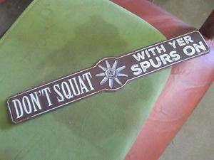 DON'T SQUAT WITH YOUR SPURS ON TIN SIGN $ CABIN DECOR