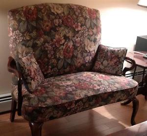 High back settee with floral upholstery