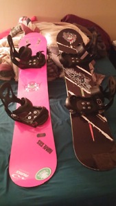 2 snowboards and boots