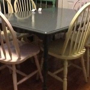 6/ chairs with large charcoal wood table