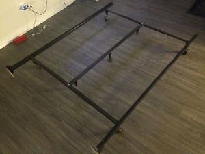 Double bed frame with middle support bar