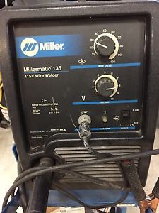 Miller v welder with stand and bottle