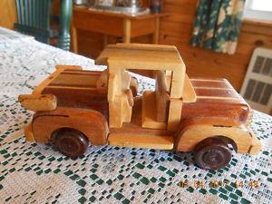 UNIQUE MINATURE HAND MADE SOLID WOOD TRUCK.