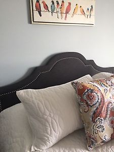 Upholstered grey king sized headboard