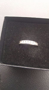 14k White Gold wedding ring with 9 diamonds.