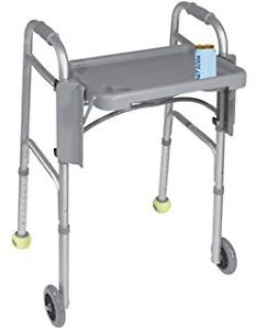 GUARDIAN WALKER WITH TRAY AND REAR LEG SLIDERS.