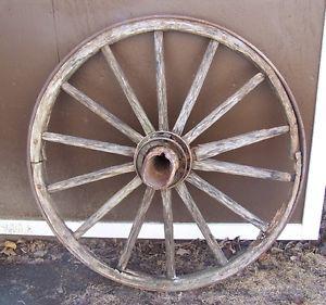 LARGE WAGON WHEEL WITH WOOD AND CENTREPIECE.GORGEOUS/RUSTIC