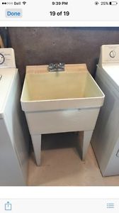 Laundry tub with faucet