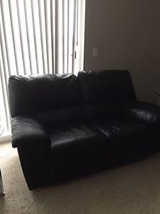 Leather reclining love seat