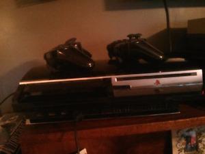 PS3 (with 2 wireless Remotes)--plays online games only.