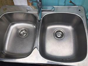 Stainless steel double sink with Moen taps